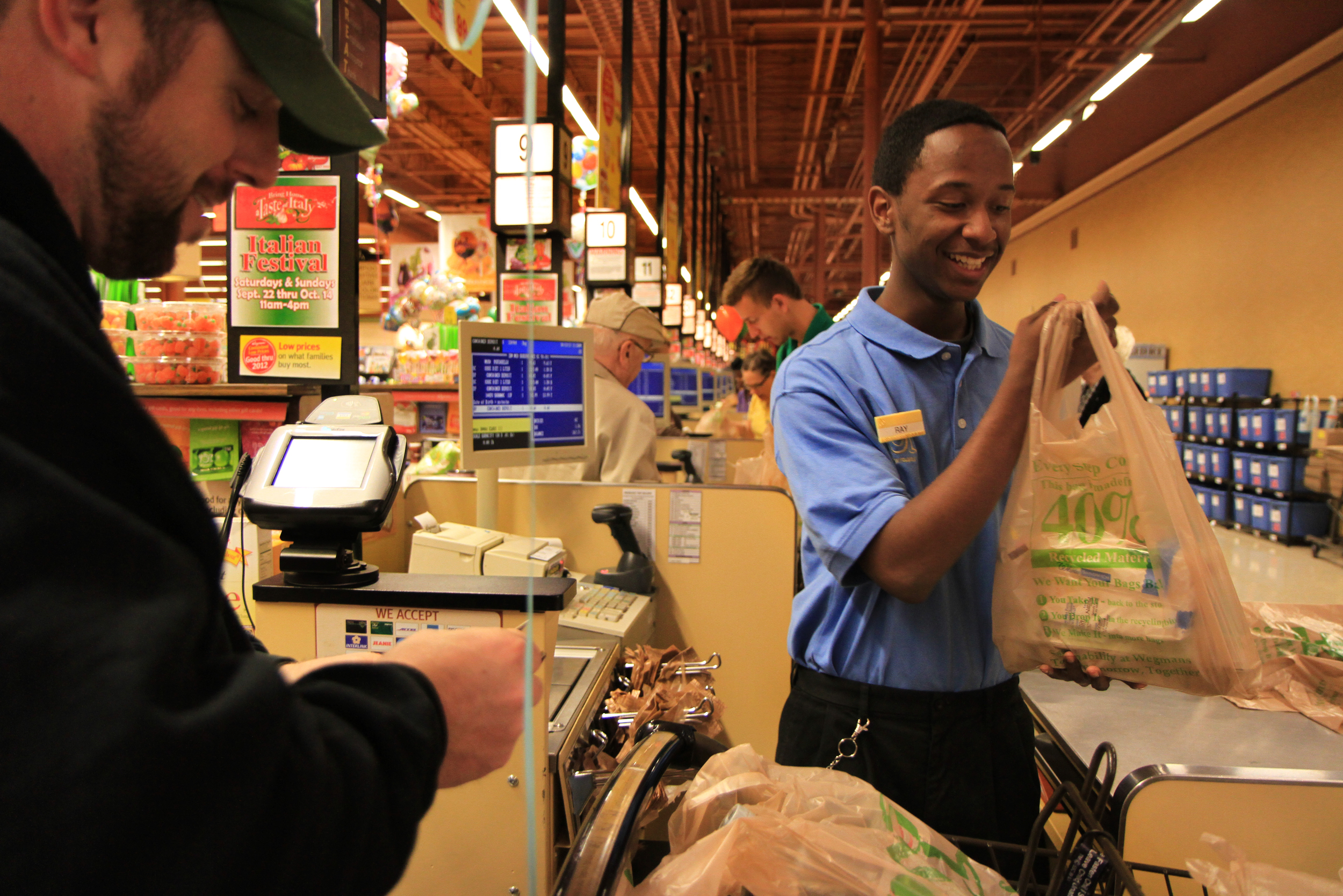  Tigner meets Josh Sandberg during his shift at Wegmans, Saturday. They are amused that they share the same birthdate.  