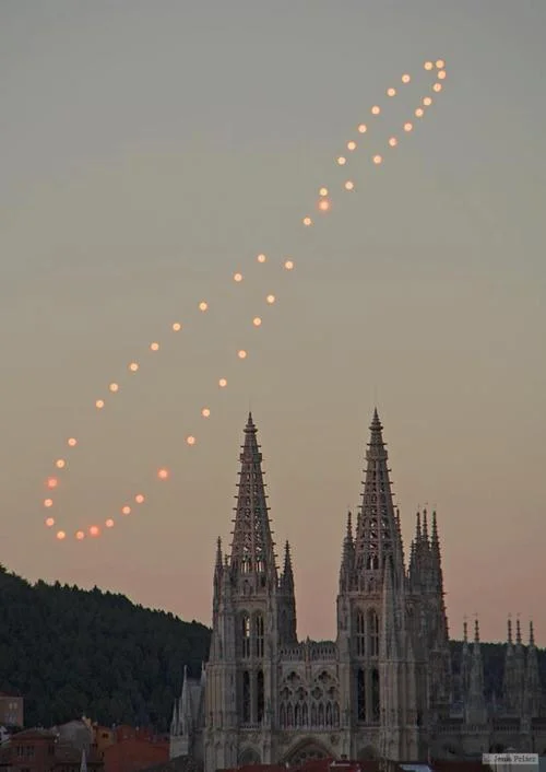 Venus's lovely path over a year's worth of still photos. Summer solstice is on top, winter at the bottom and equinox where they cross. Via