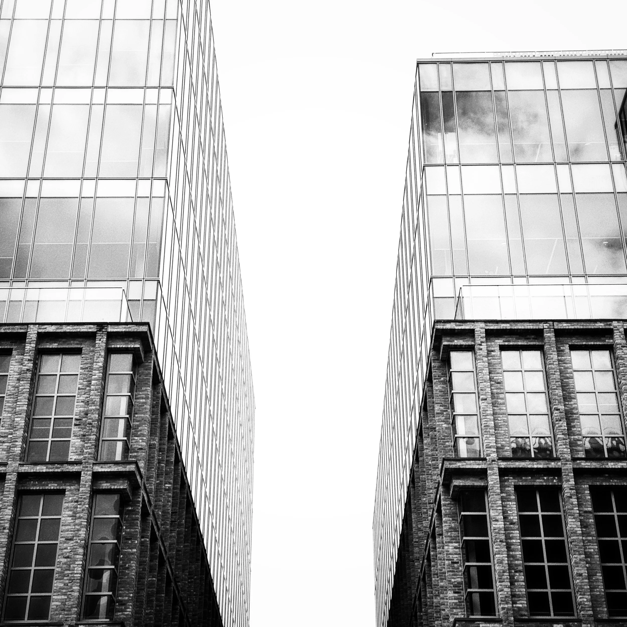 Symmetry

Exploring a complex of buildings at the weekend for my weekly phone image, the symmetry between these buildings, the changing textures between brick and glass, scale being the only difference.