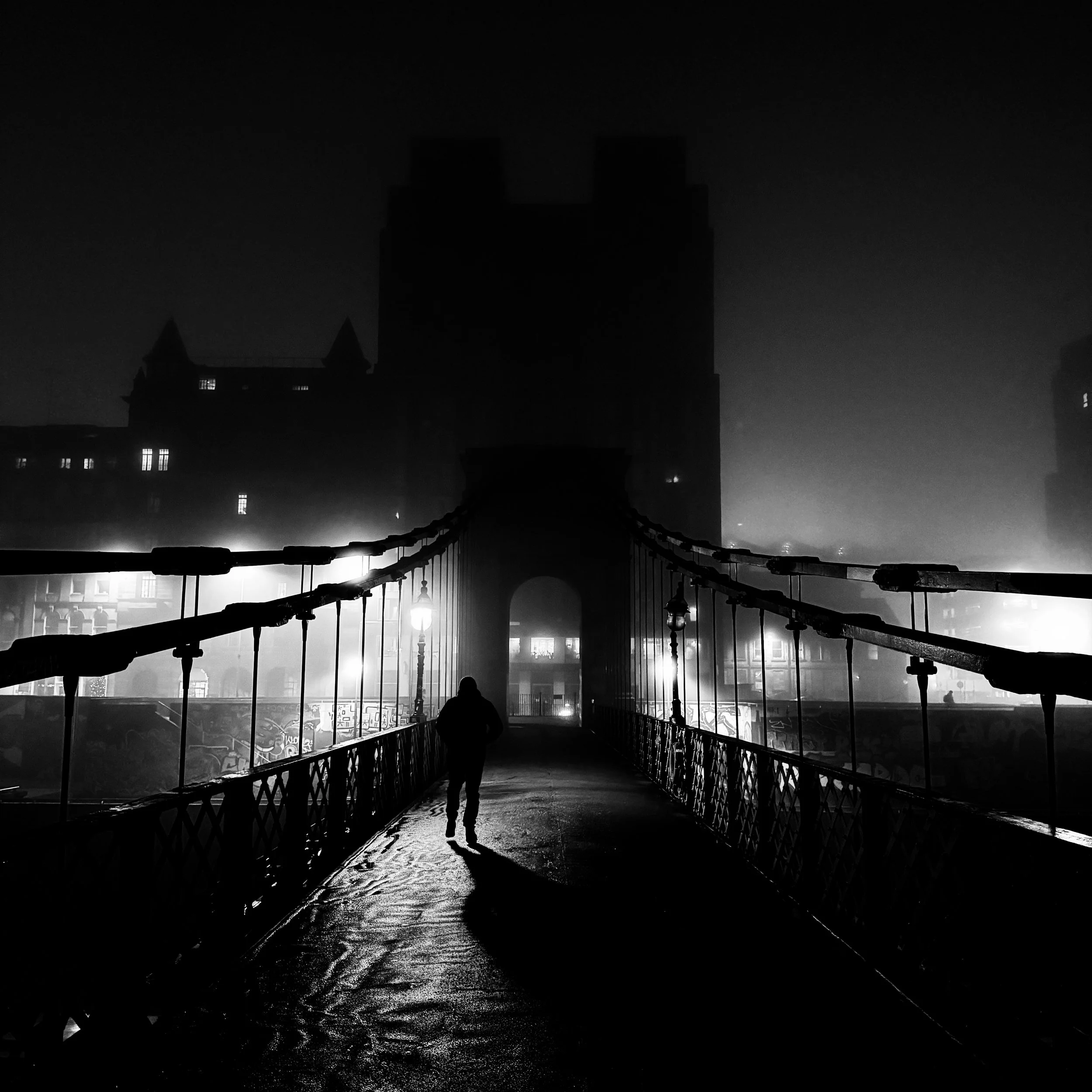 Gotham

I don’t know why, it’s not like I am a huge fan, but this gives me the feel of Gotham City.

Dark winters morning with a lone figure crossing the bridge and the dominant city landscape in the background.