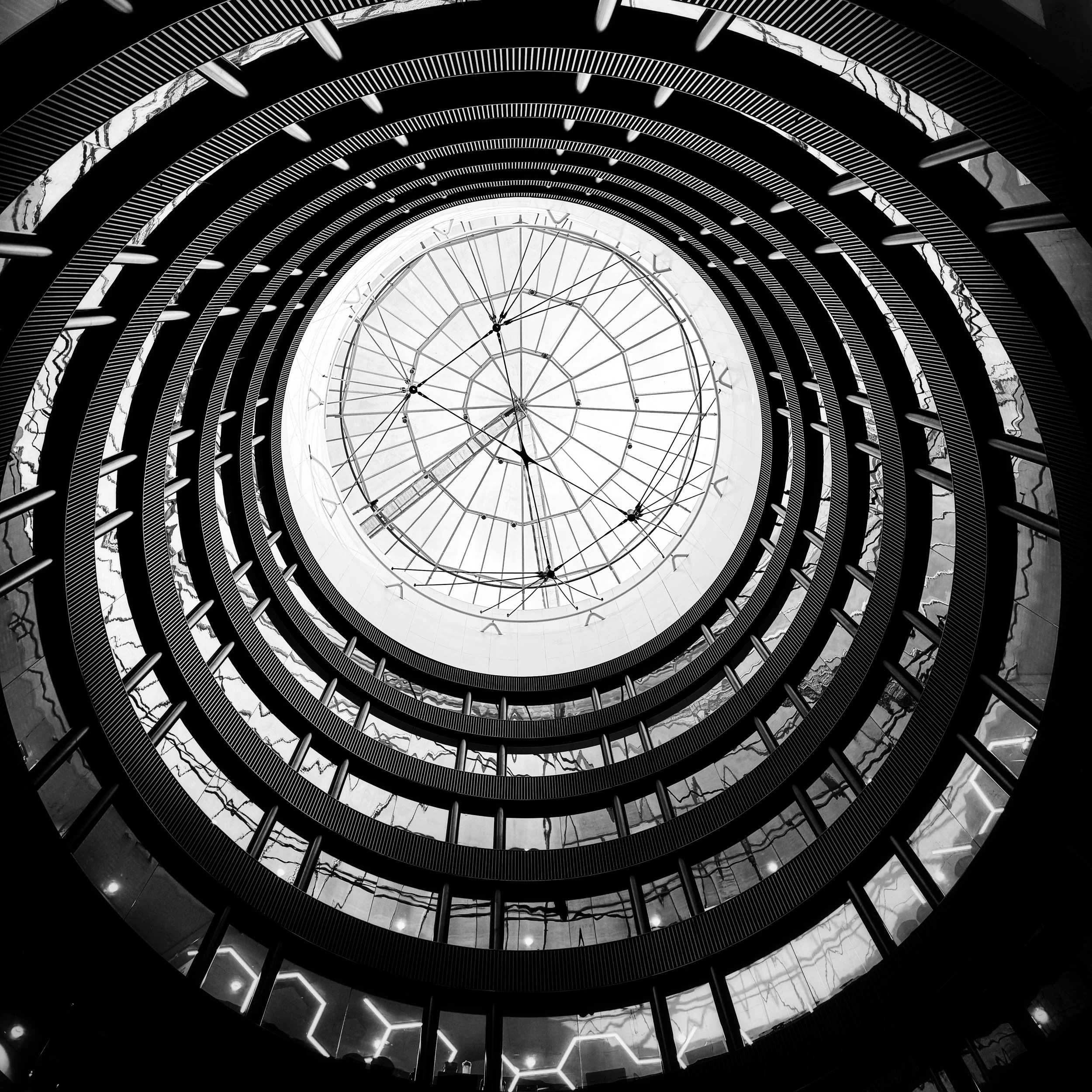 This week I was going round in circles trying to get #myweeklyphoneimage (sorry for the terrible pun).
I really like the bright bands of light and reflections through the levels as you get to the sky, the circular motion narrowing as you reach the t