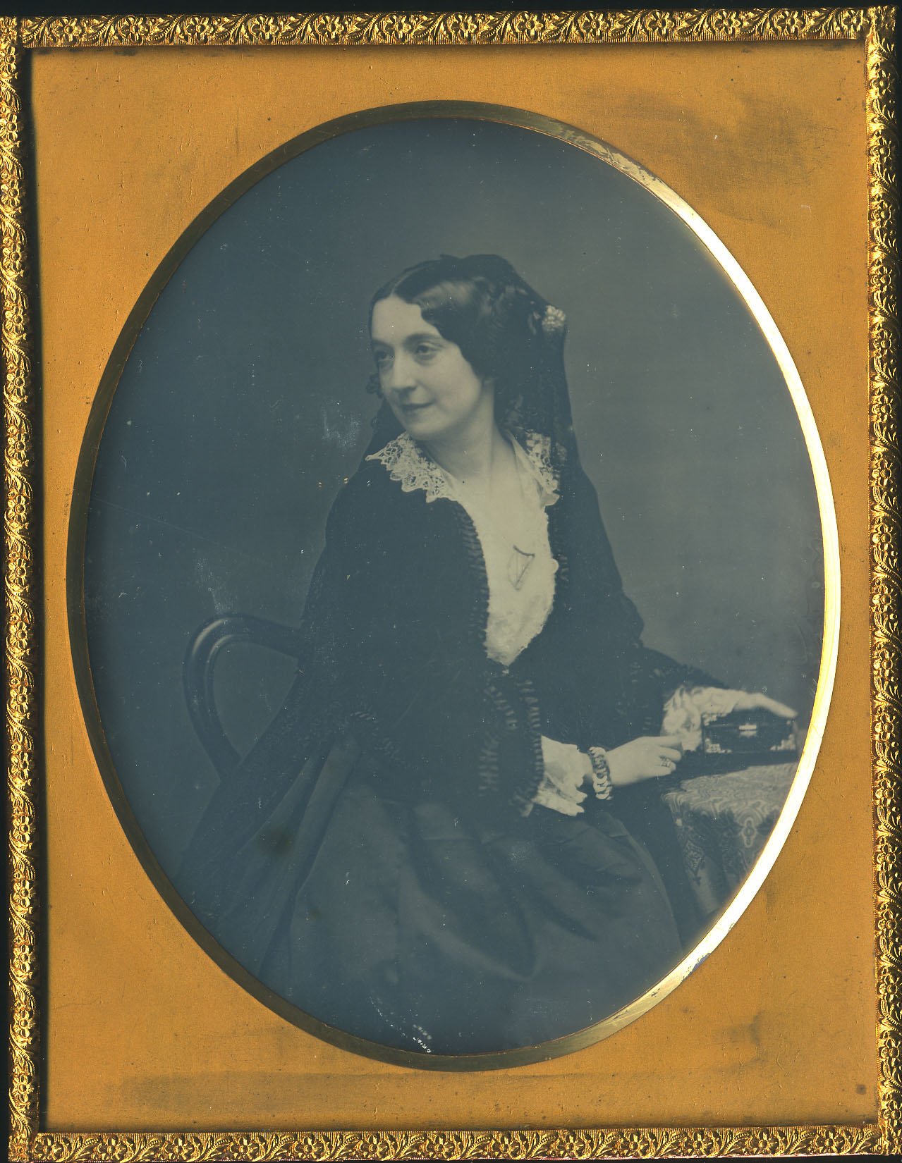 Woman Sitting Wearing Black Veil