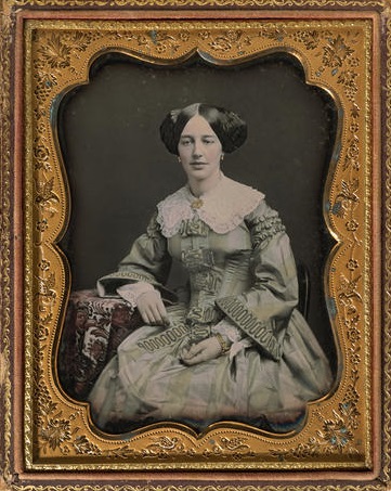 Woman Leaning on Tapestry Side Table