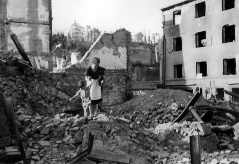 The subjects in this photo comb through the ruins of their apartment building after their city was bombed during World War II. While not all of us have such dramatic photos, look for photos that invoke a strong emotional response.