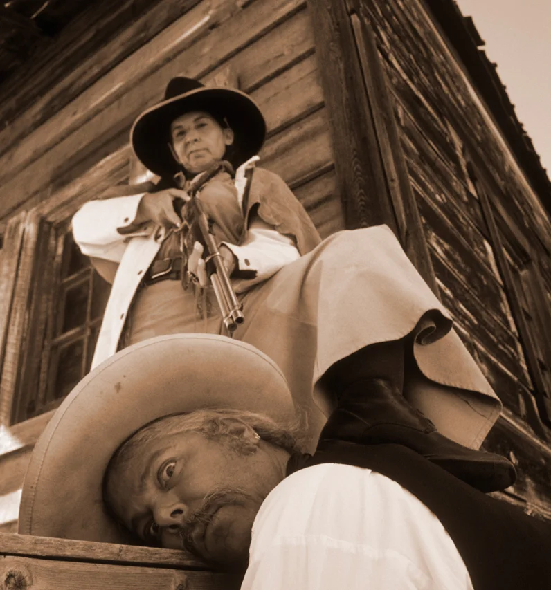 The combination of using a wide angle lens close up and an extreme angle (shooting up from the ground) is used to comic effect.