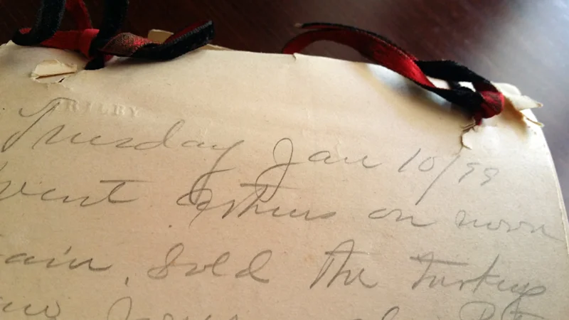 Papers tied with ribbon, and an inexplicable "Trilby" stamped in the upper left corner of each page.