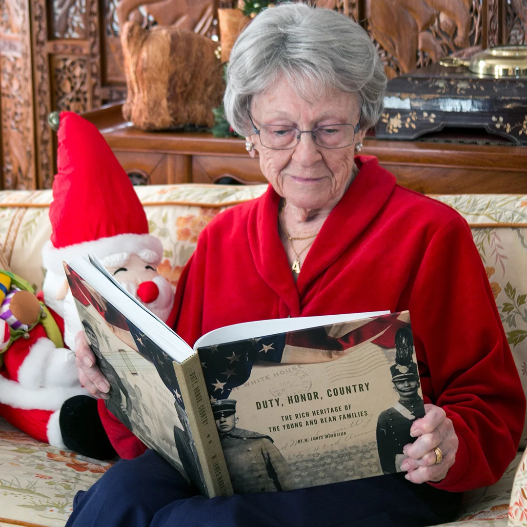 Bettye today, seeing the finished product for the first time. She is holding the 10" square book that was given to family members. We also printed a spectacular oversize coffee-table version at twelve inches square.
