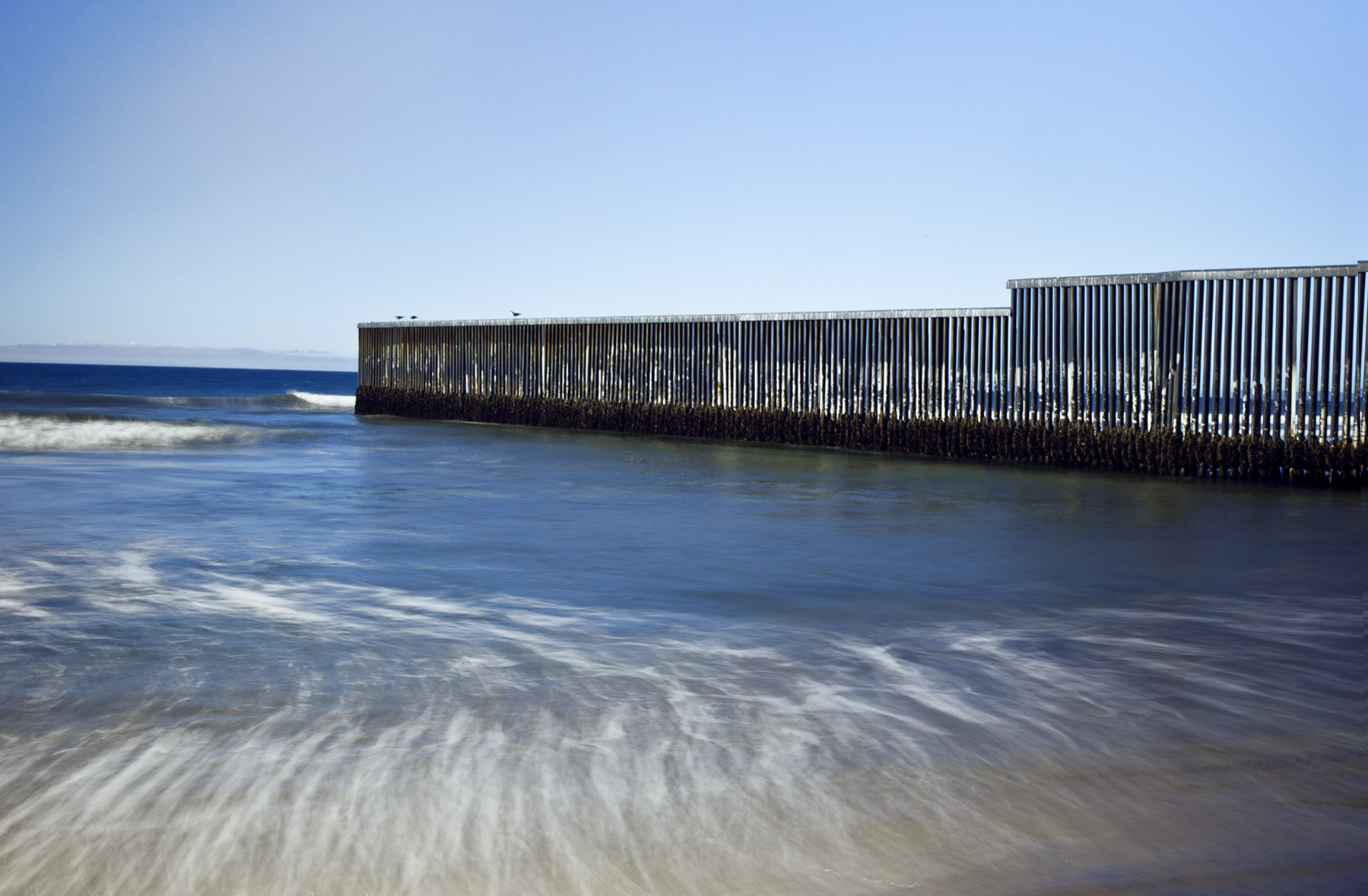 Tijuana border into the Pacific Here, it ends. But beyond the border's last physical pillar, Border Patrol maintains a strong presence to prevent attempted crossings via the Pacific. 