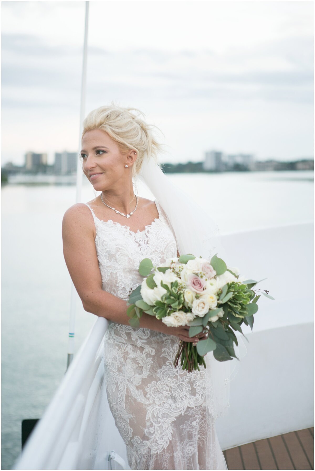  Bride holding bouquet on the water 