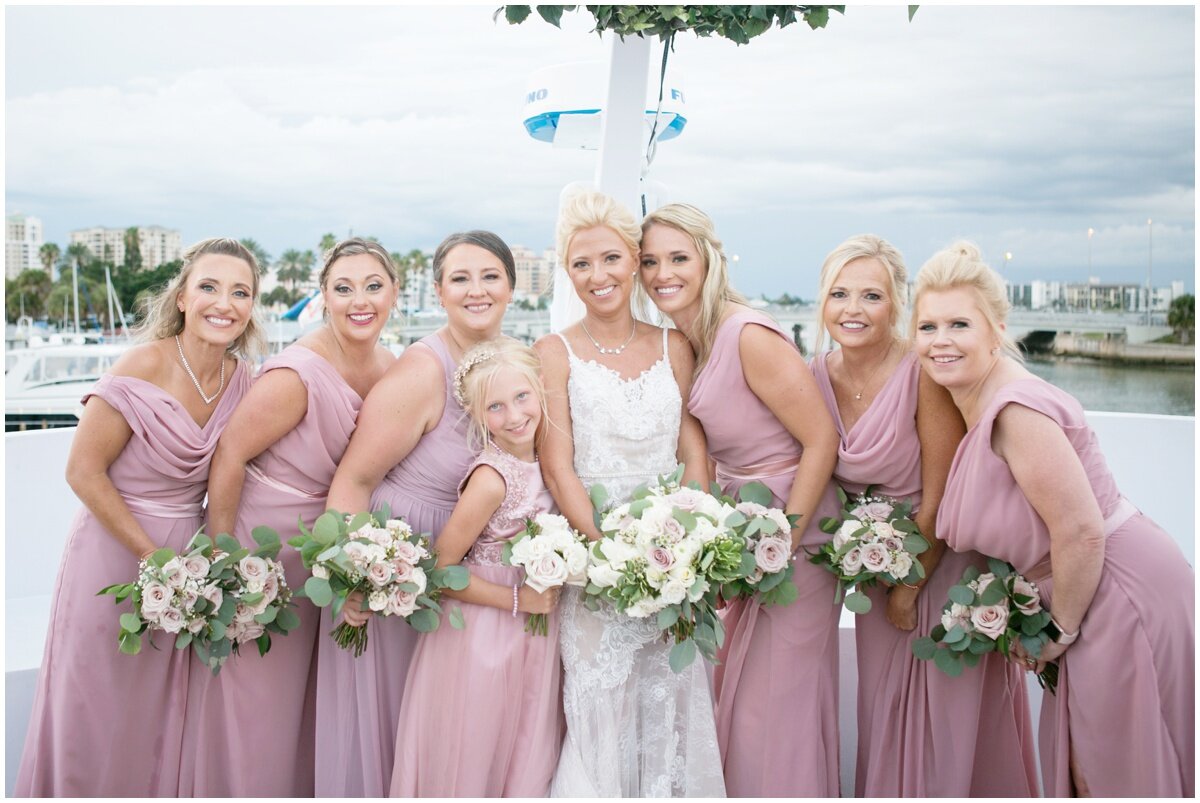  Bridesmaids in pink with bride, white bouquets 