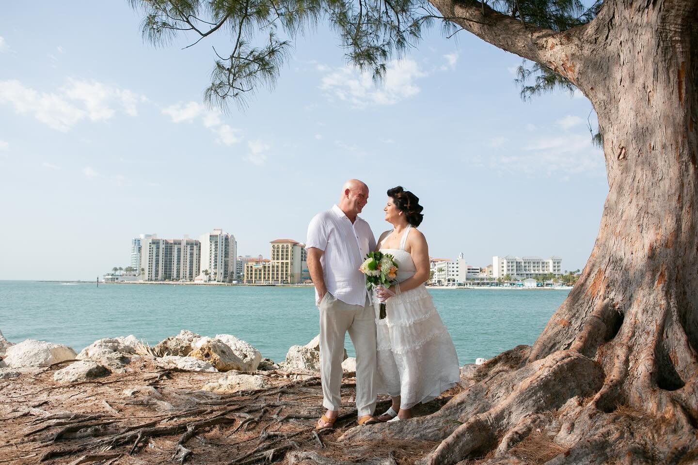 Melissa &amp; Christopher&rsquo;s intimate Sand Key Beach wedding was pure magic! One of my favorite touches? Melissa asked all their guests to wear light colors, creating the most beautifully coordinated and serene photos. The love, the joy, and the