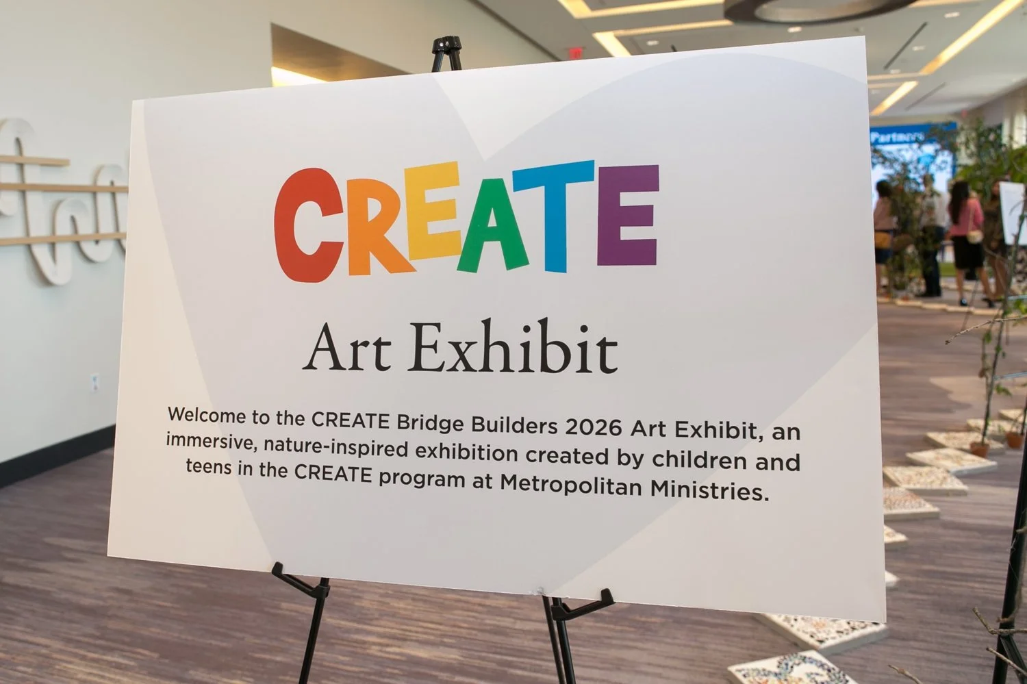 CREATE Art Exhibit sign at Metro Ministries Bridge Builders 2026 JW Marriott Tampa — Carrie Wildes Photography