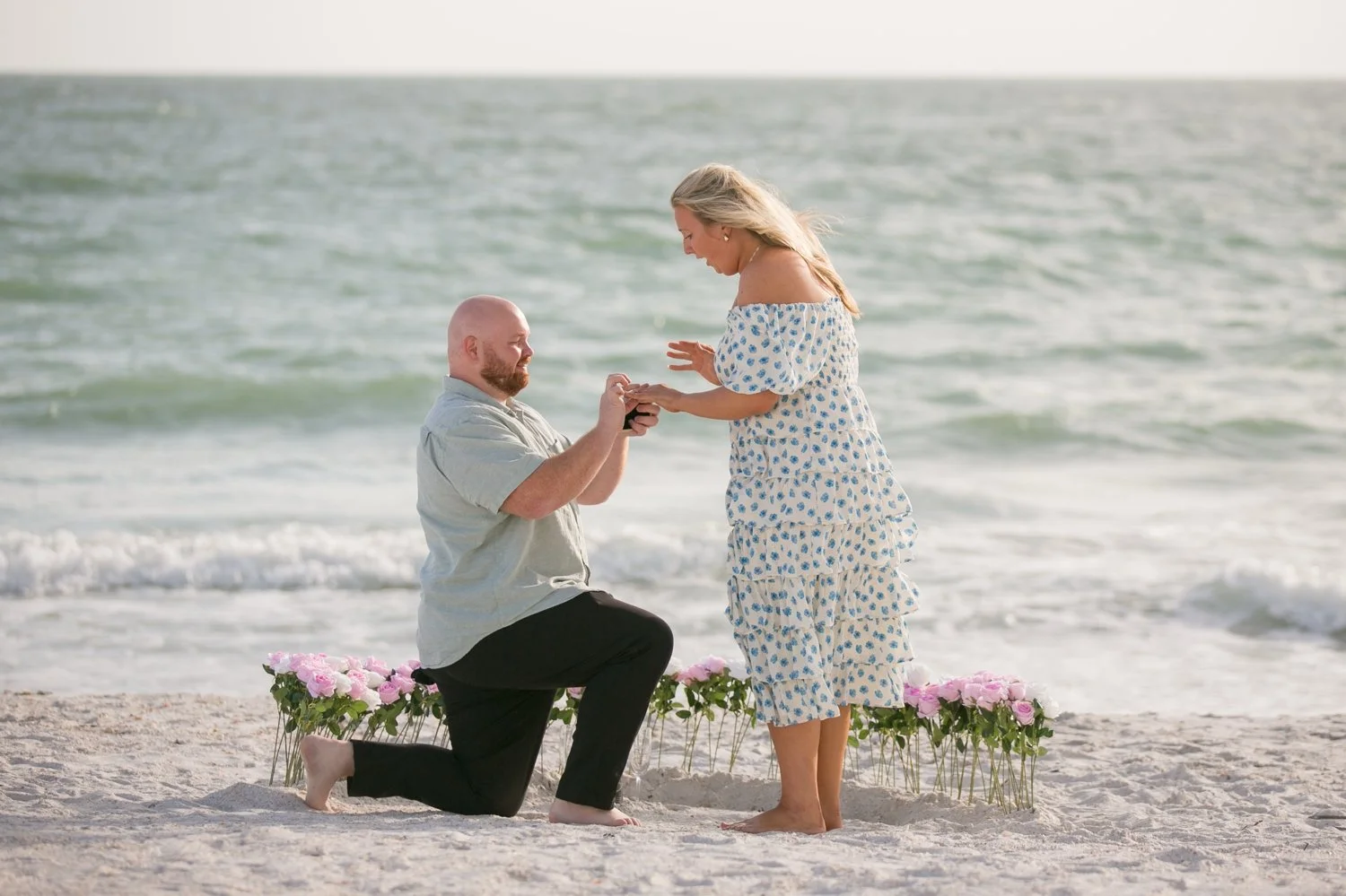 Surprise proposal moment as the ring is placed on her finger at Upham Beach, St. Pete Beach
