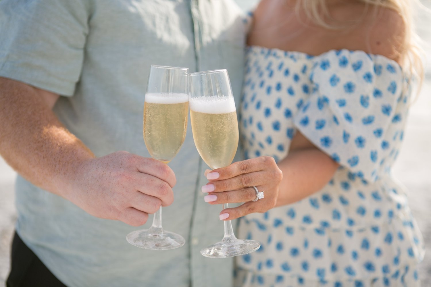 Bride-to-be showing her engagement ring to family after a surprise proposal in St. Pete Beach