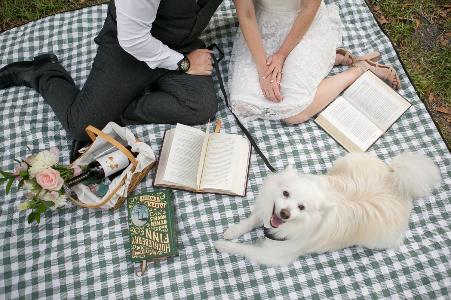 Bookish picnic engagement session under the banyan trees in downtown St. Pete with their dog