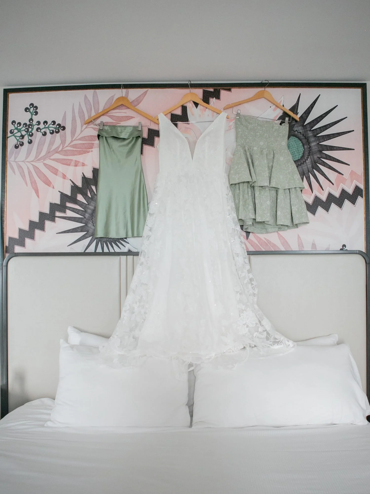 Details, details, details. 🕊️ Lisa &amp; Tyson&rsquo;s wedding day at the iconic Pink Palace was soft, romantic elegance with sage green bridesmaid dresses, a lace-drenched gown with the dreamiest train, gold sandals, peach and blush garden roses, a