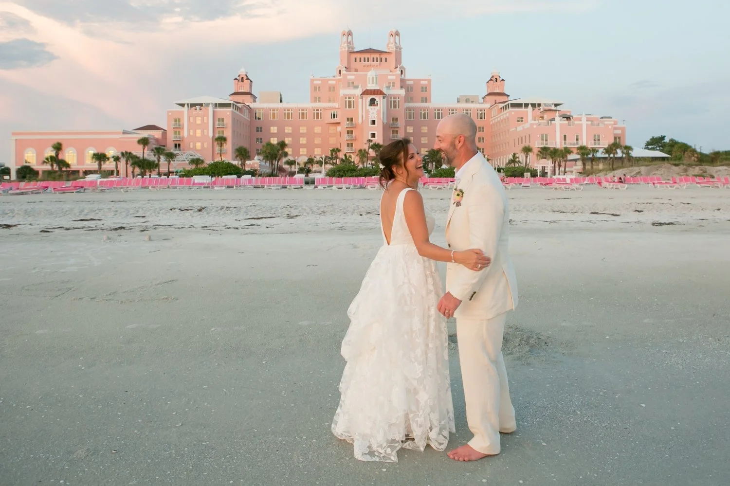 Bride and groom just after they got married with the don cesar in the background