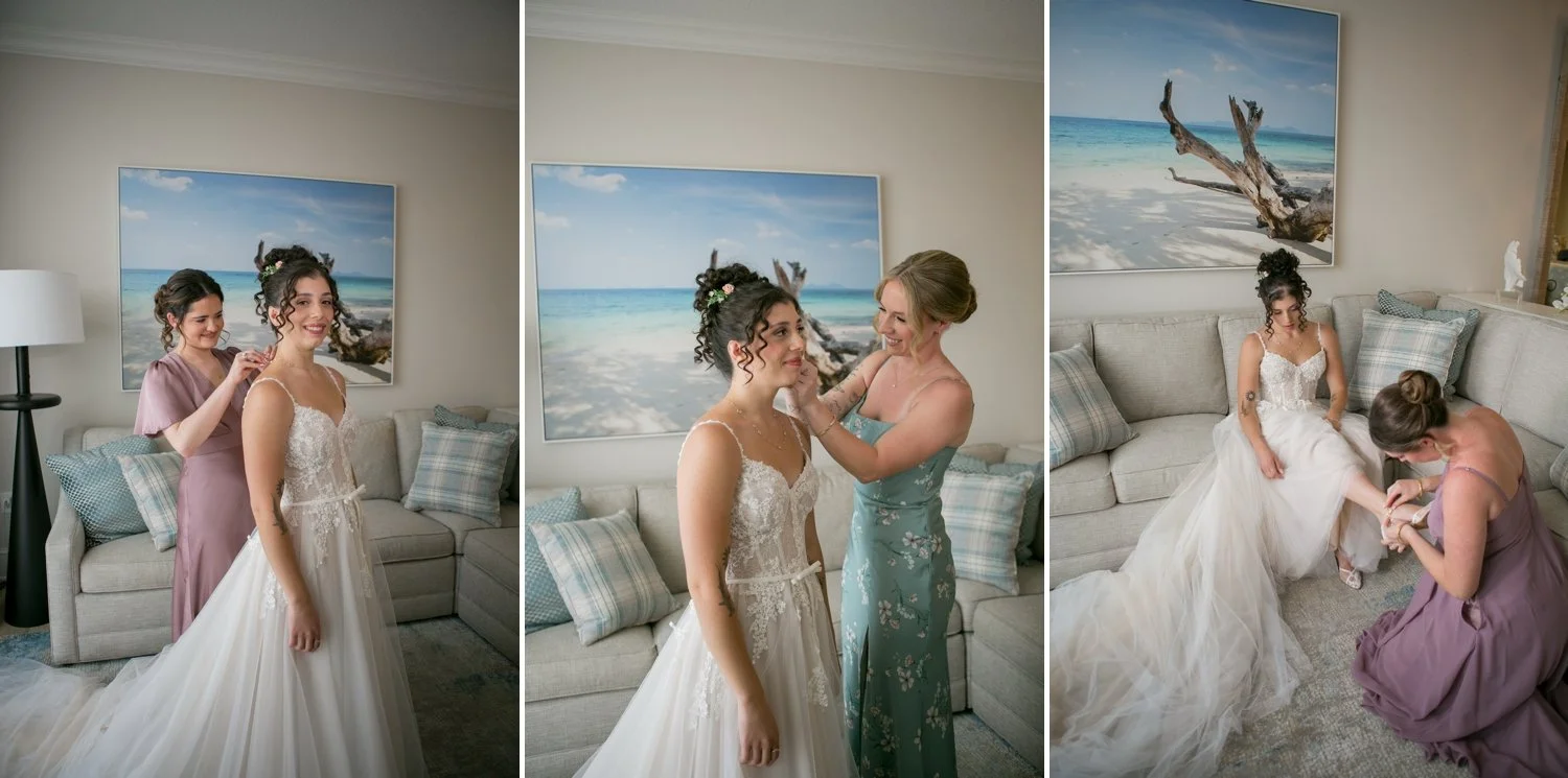 Bridesmaids helping bride with earrings and shoes before Sand Pearl Resort wedding — Carrie Wildes Photography