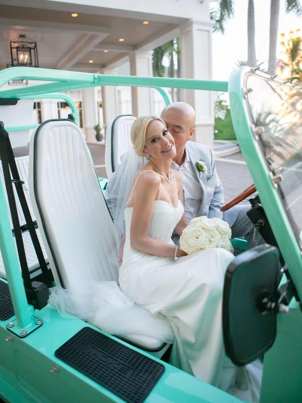 Stacey + Kris have a teal Moke they love cruising around Clearwater Beach in, so of course it came to the wedding!! 💍🌴

A &ldquo;Just Married&rdquo; sign on the back, golden hour light coming through the palms, and these two stealing kisses behind 