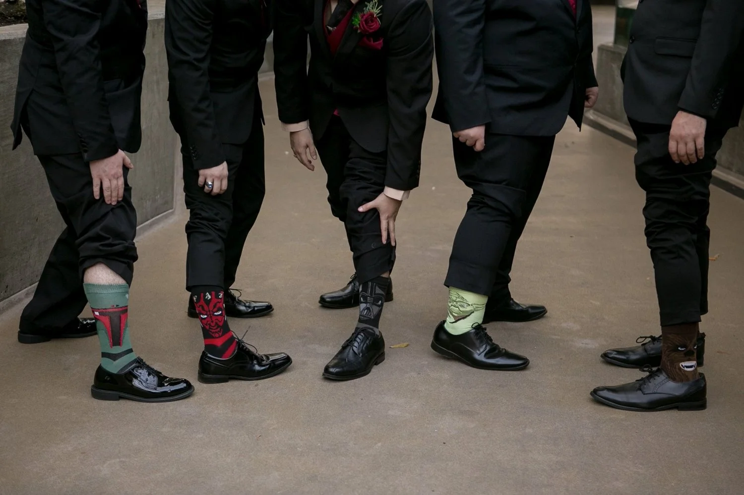 Groomsmen showing off their themed wedding socks