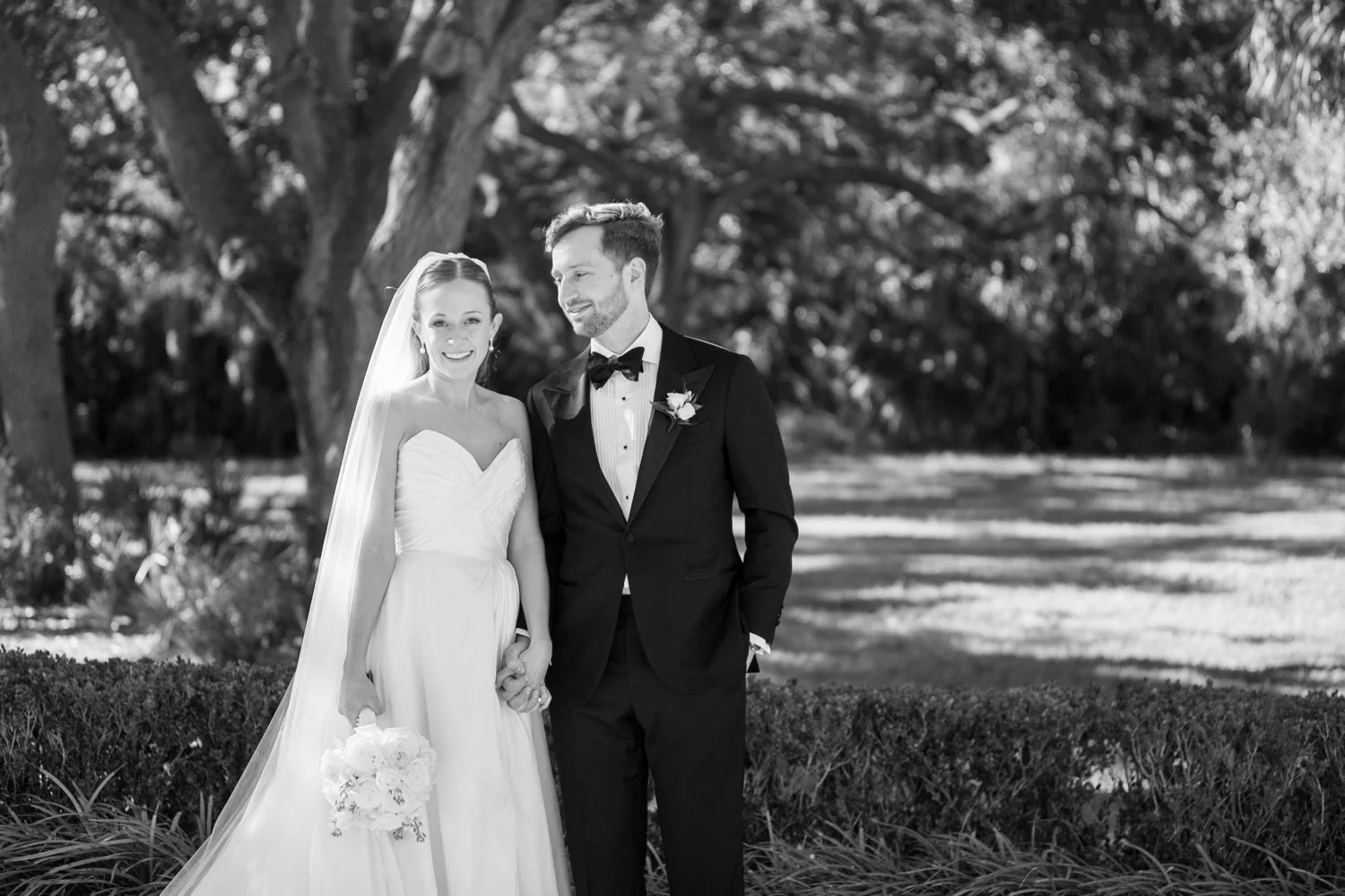 Couple in black and white outside of Harborside Chapel wedding, Tampa wedding photographer Carrie Wildes