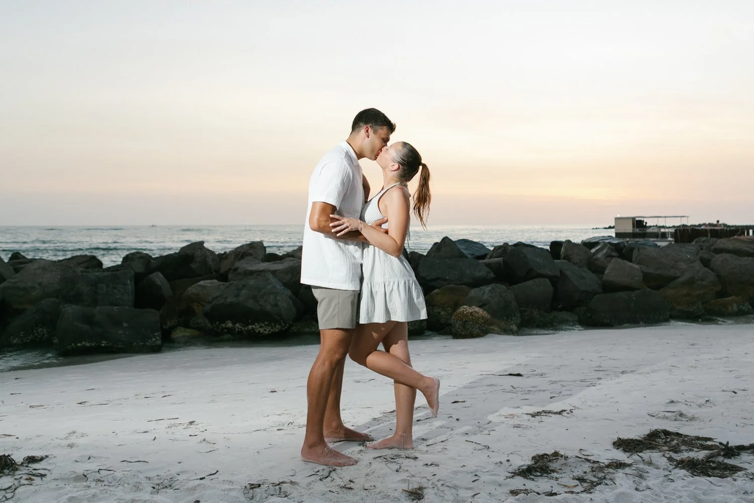 Couple at sunset who just got engaged at St. Pete Beach