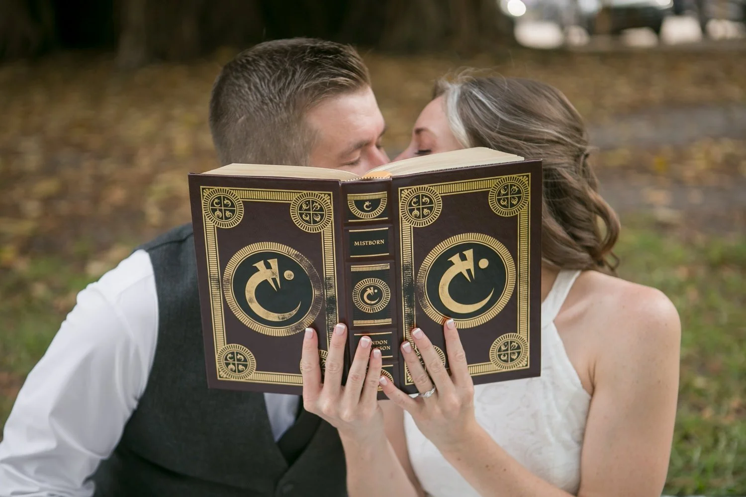 engagement-session-mistborn-book-kiss.jpgCouple kissing behind a Mistborn book during their downtown St. Petersburg engagement session