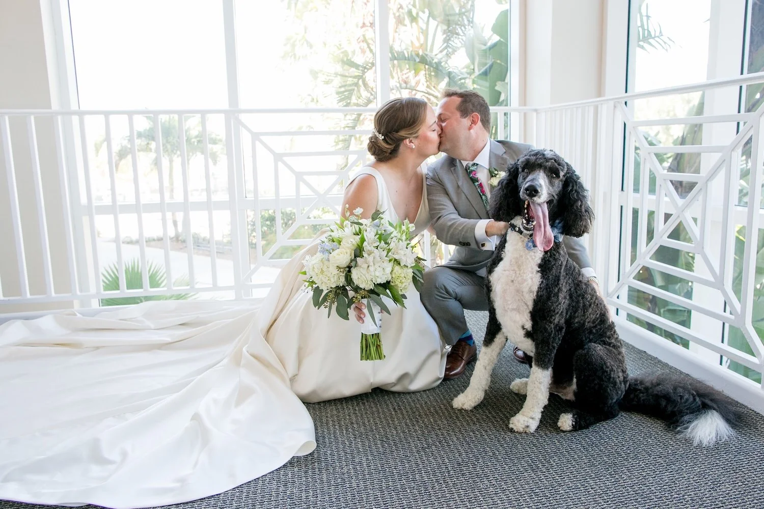 couple who just got married with their dog at Isla Del Sol Yacht and Country Club