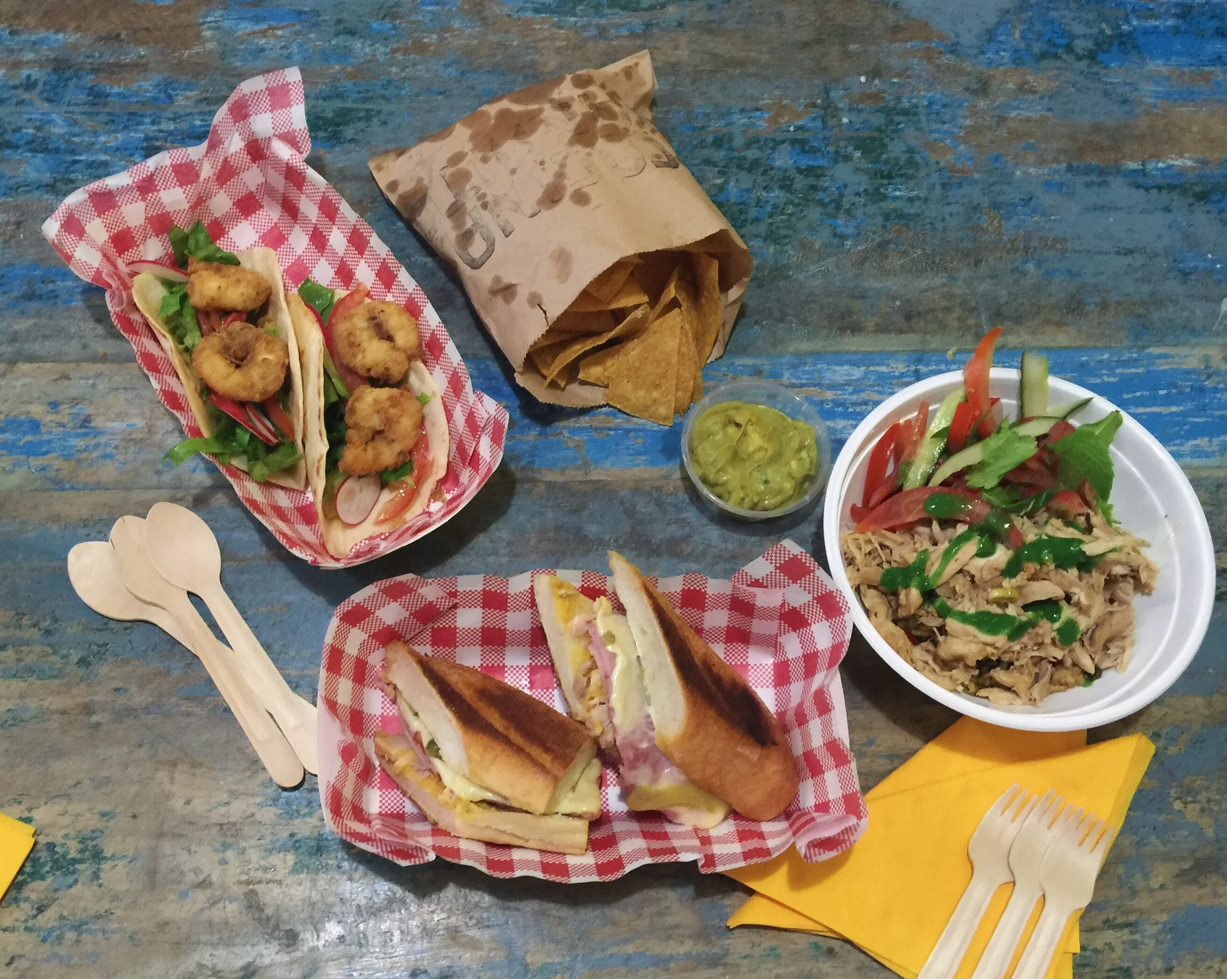 Cuban missile BBQ prawn open tortilla $13 Totally gluten free chips with fresh guacamole $7 El Presidente chicken and rice $13 Bay of Pigs traditional 'Cubano', roast pork belly sandwich $13