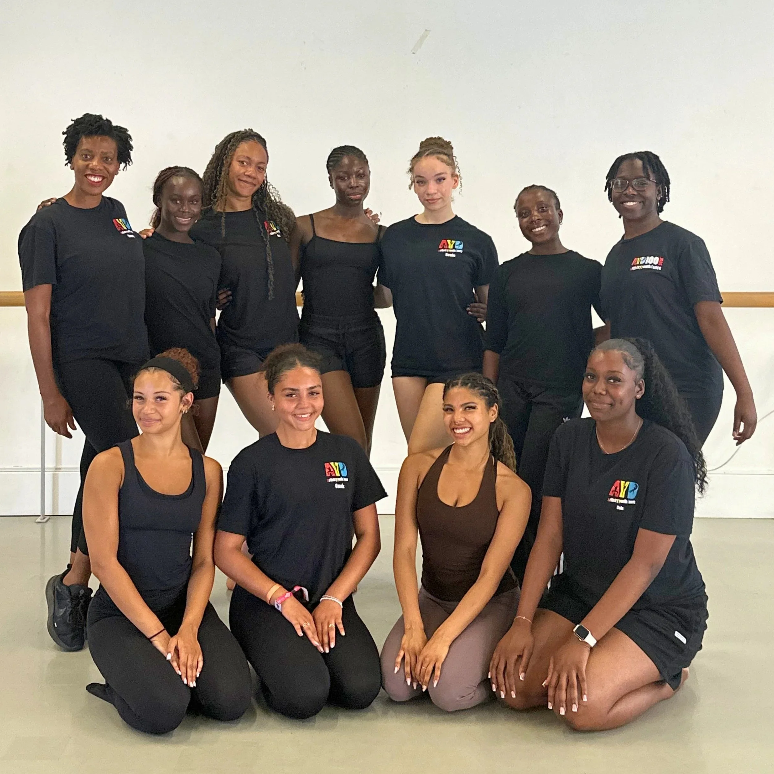 Group of young Black dancers posing in a dance studio