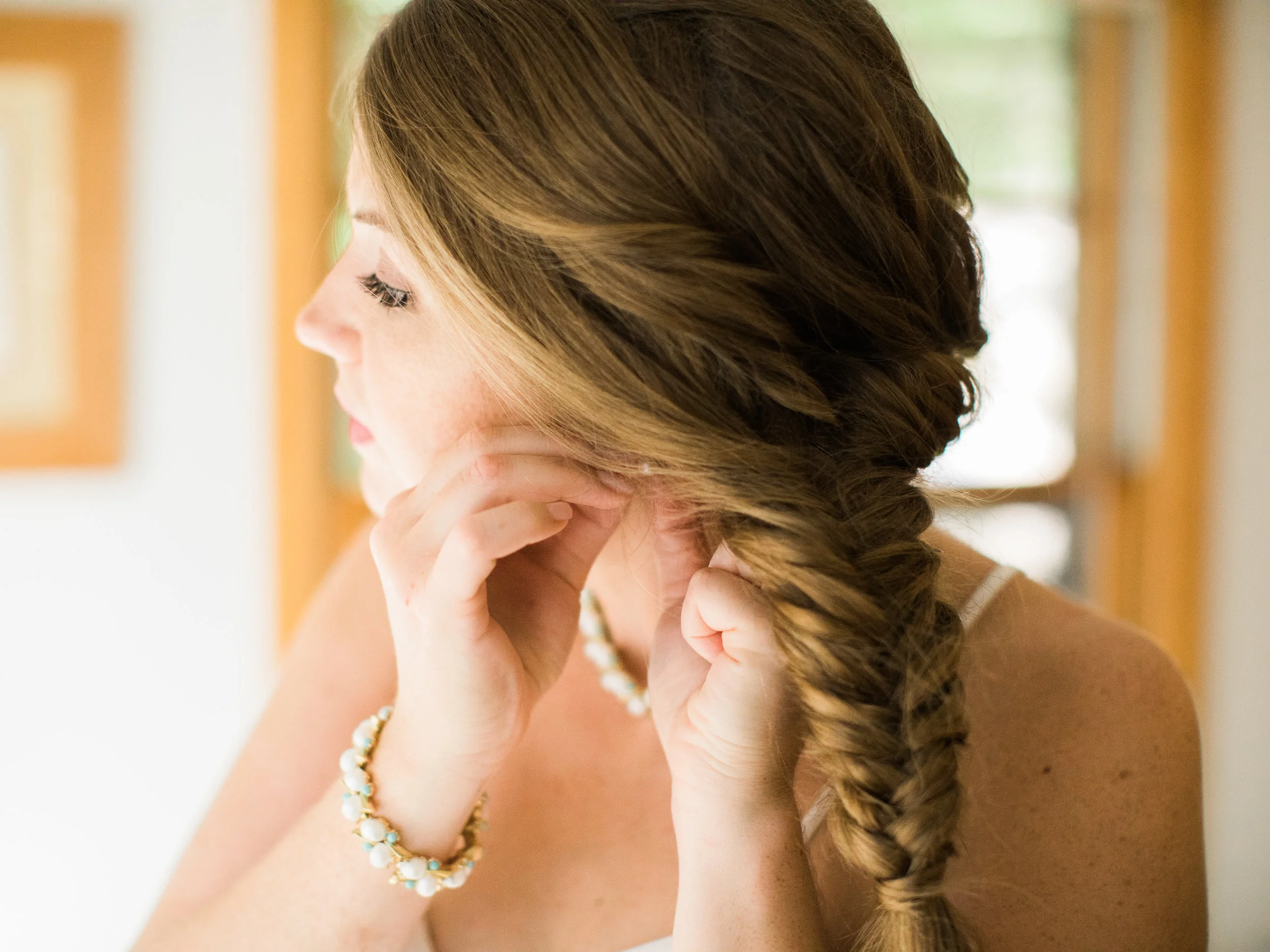 Bride getting ready at her lake cabin in Northern Minnesota