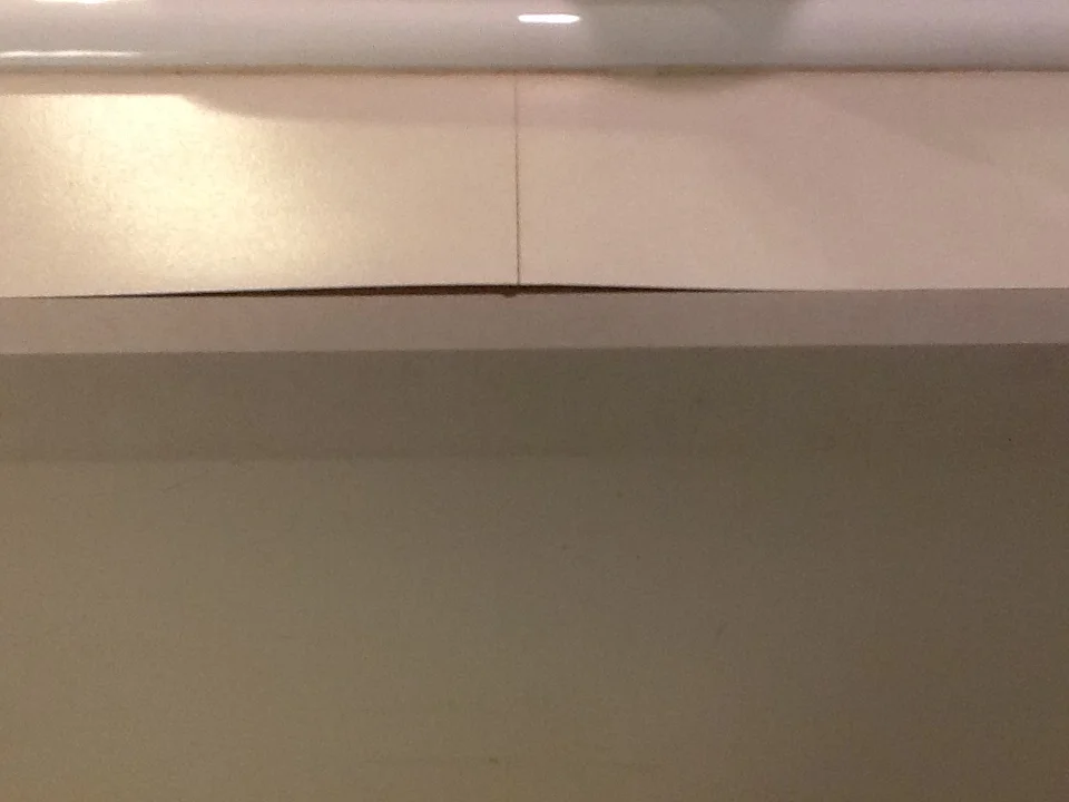 Before shot of a laminate counter with a seam. This is why you don't want seams in your counter