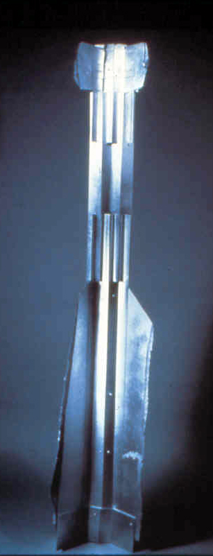 Construction #4, nobody important cardboard, aluminum spray paint 50" x 12" x7" , 1/15/1986 collection of the artist