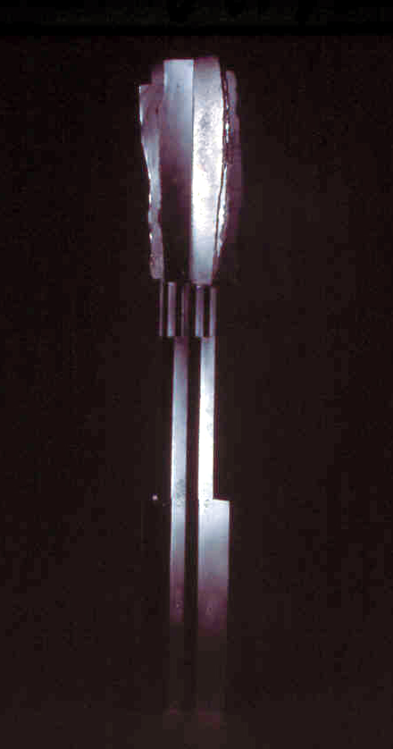 Construction #2, emerging figure cardboard, aluminum spray paint 48" x 14" x 2" collection of the artist