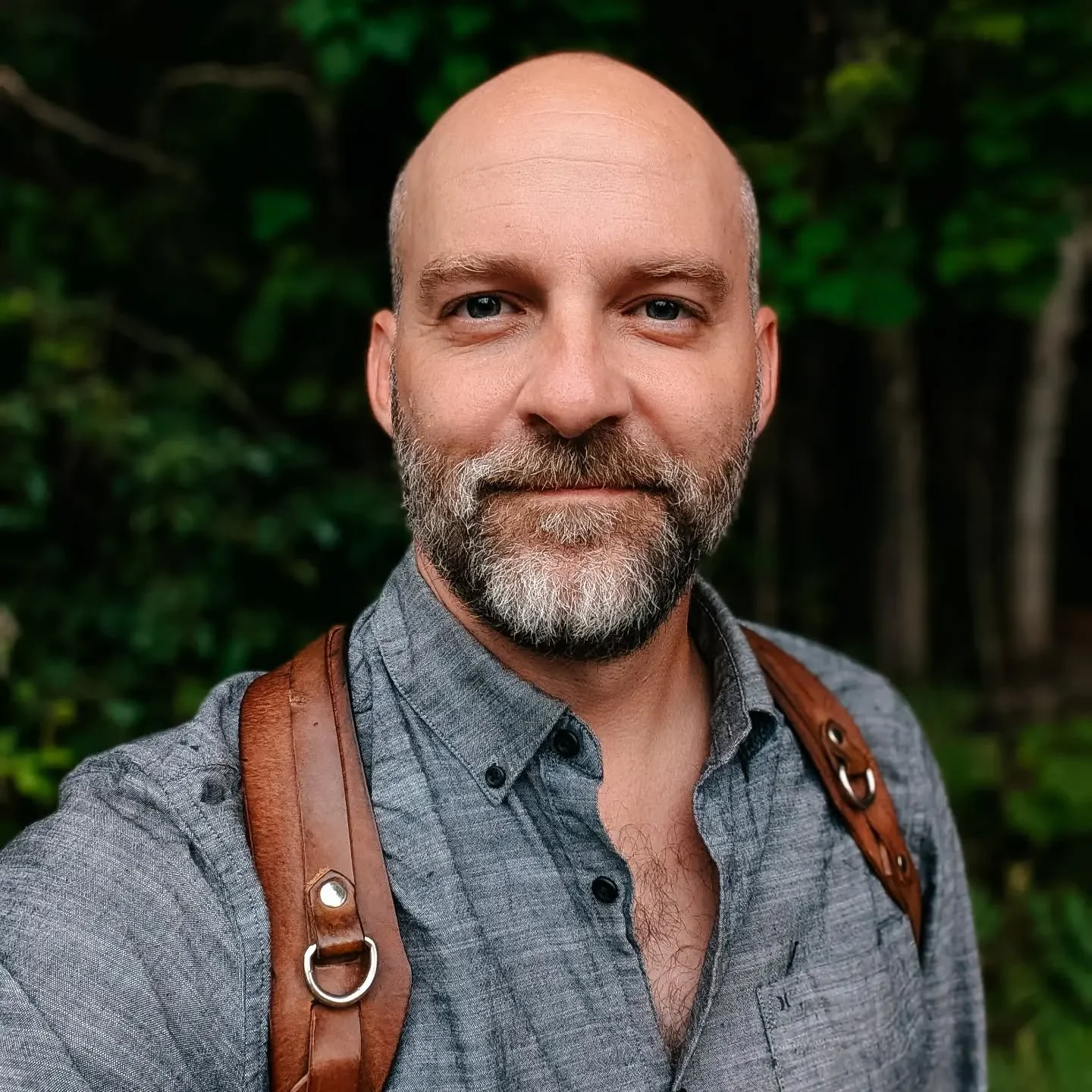 This is I, the man behind the lens. 

Raised by wolves, educated by the internet, always flowing like a river.

My 10-year-old self wanted to be an architect when I grew up, and now here I am dressed like John McLane, holsters and all, just shooting 