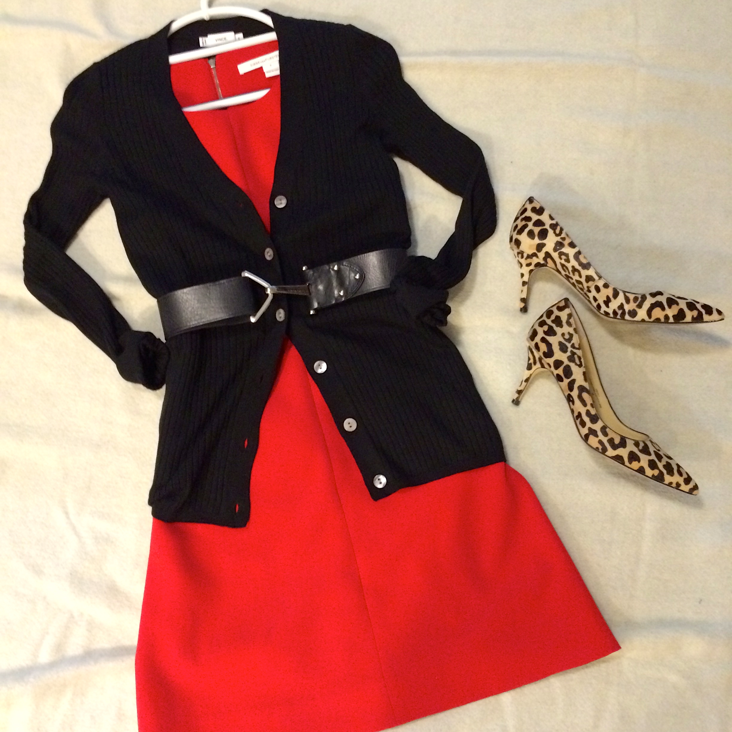 Black cardigan by Vince. Cheetah print heels by Ivanka Trump. Belt by Vince Camuto.