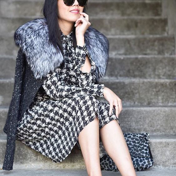 There is definitely something to be said for darker neutrals as a showcase for texture. What makes this so exciting is the range of color within the textures - the fur collar ranges from dark charcoal to almost white, the tweedy sweater has flecks of ivory, and the houndstooth dress provides even deeper contrast. (Photo from 9to5Chic )