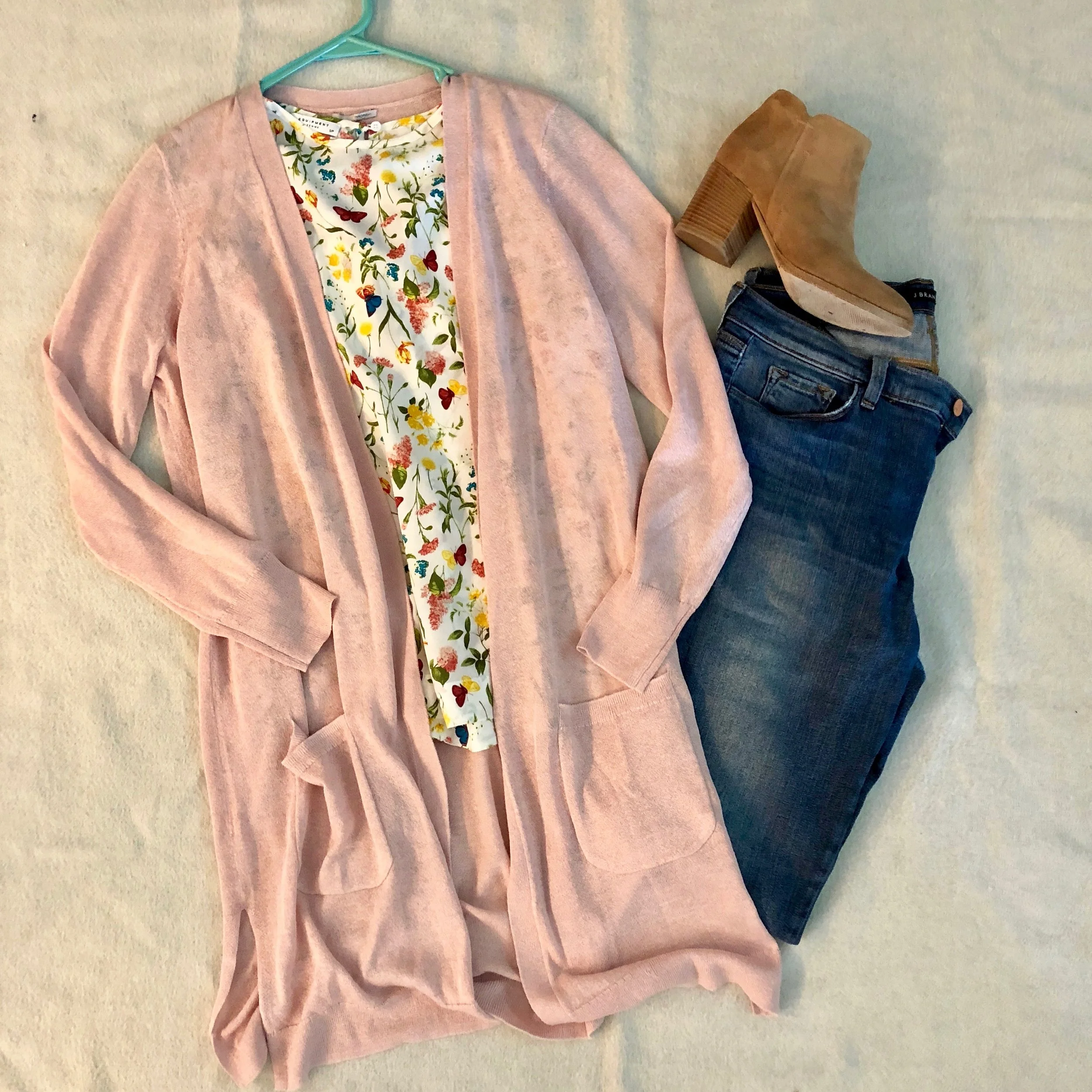 My client loves this floral print blouse, but planned on only wearing it to the office - so I showed her how to pair it with jeans and booties for a movie night with friends.