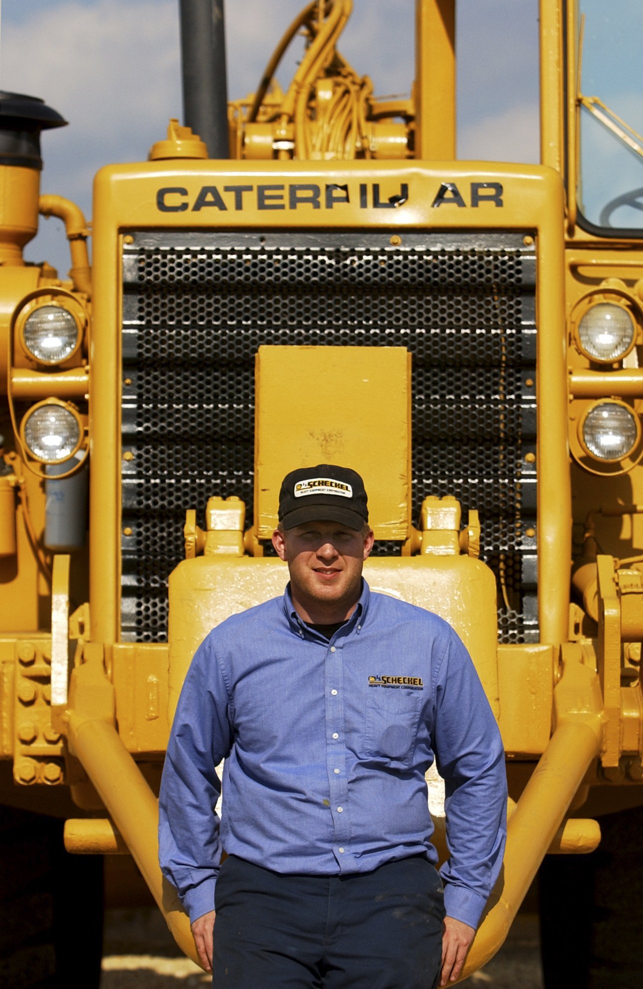  Josh Scheckel of J.J. Scheckel Corp. outside Bellevue, Iowa. Technology allows the sale of Scheckel's refurbished equipment all over the country. 