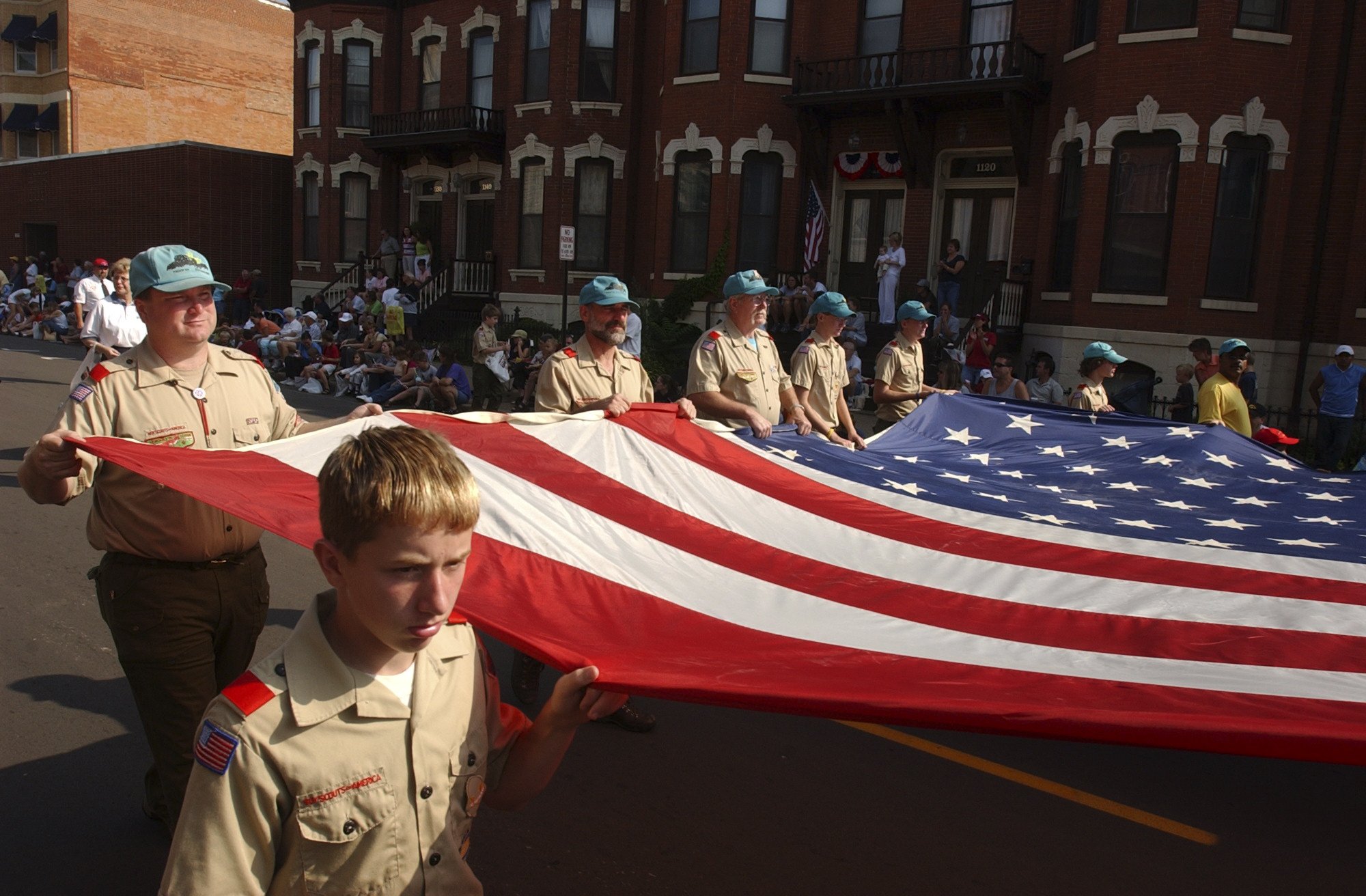  Donald Schmitt, 13. of Boy Scout troop 94, carries the American flag in the Dubuque Labor Day parade. 