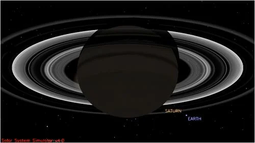 This simulated view from NASA's Cassini spacecraft shows the expected positions of Saturn and Earth on July 19, 2013, around the time Cassini will take Earth's picture. Cassini will be about 898 million miles (1.44 billion kilometers) away from Earth at the time. That distance is nearly 10 times the distance from the sun to Earth.