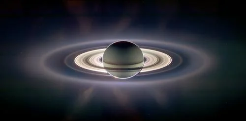 Cassini created this panoramic view of the Saturn system, with Earth appearing as a pale blue dot, in 2006.