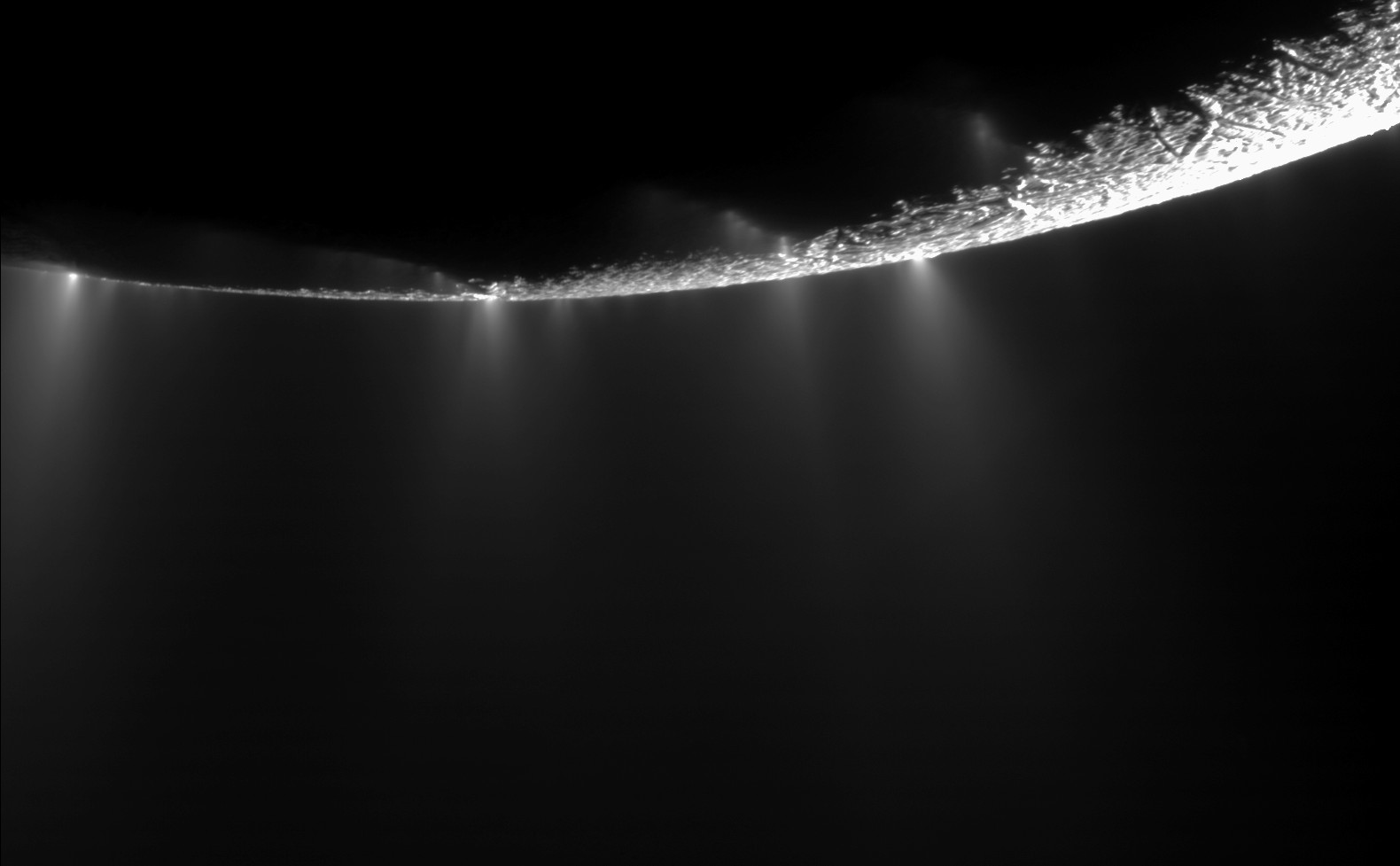 A view of the limb of Enceladus taken by the Cassini spacecraft showing water vapour rising above the moon.