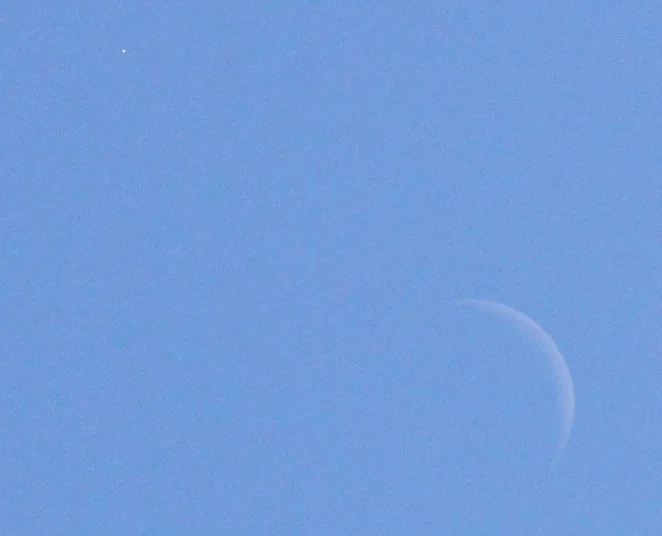 The Moon and Venus during the day. Photo by Randy Attwood