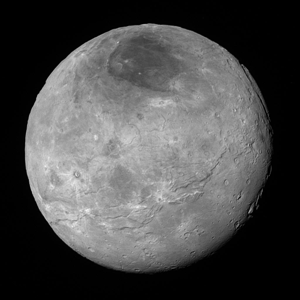 This image of Pluto’s largest moon Charon, taken by NASA’s New Horizons spacecraft 10 hours before its closest approach to Pluto on July 14, 2015 from a distance of 290,000 miles (470,000 kilometers), is a recently downlinked, much higher quality version of a Charon image released on July 15. Charon, which is 750 miles (1,200 kilometers) in diameter, displays a surprisingly complex geological history, including tectonic fracturing; relatively smooth, fractured plains in the lower right; several enigmatic mountains surrounded by sunken terrain features on the right side; and heavily cratered regions in the center and upper left portion of the disk. There are also complex reflectivity patterns on Charon’s surface, including bright and dark crater rays, and the conspicuous dark north polar region at the top of the image. The smallest visible features are 2.9 miles 4.6 kilometers) in size.