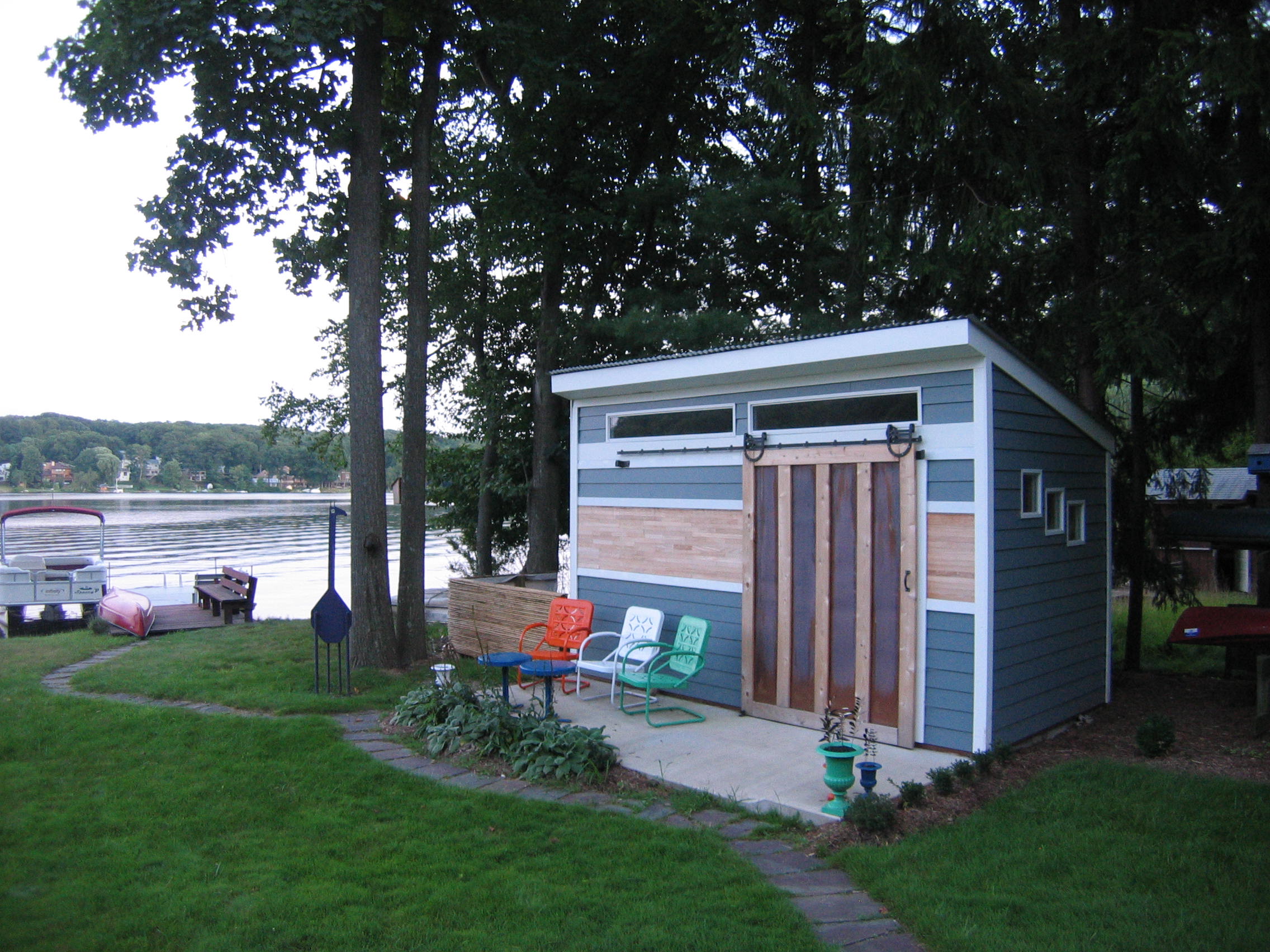  Distinctive&nbsp;clients in White Meadow Lake sought a unique solution for a shed. Part boat-house, part green-house, part art-cottage. The view and sculptures complete the look. 