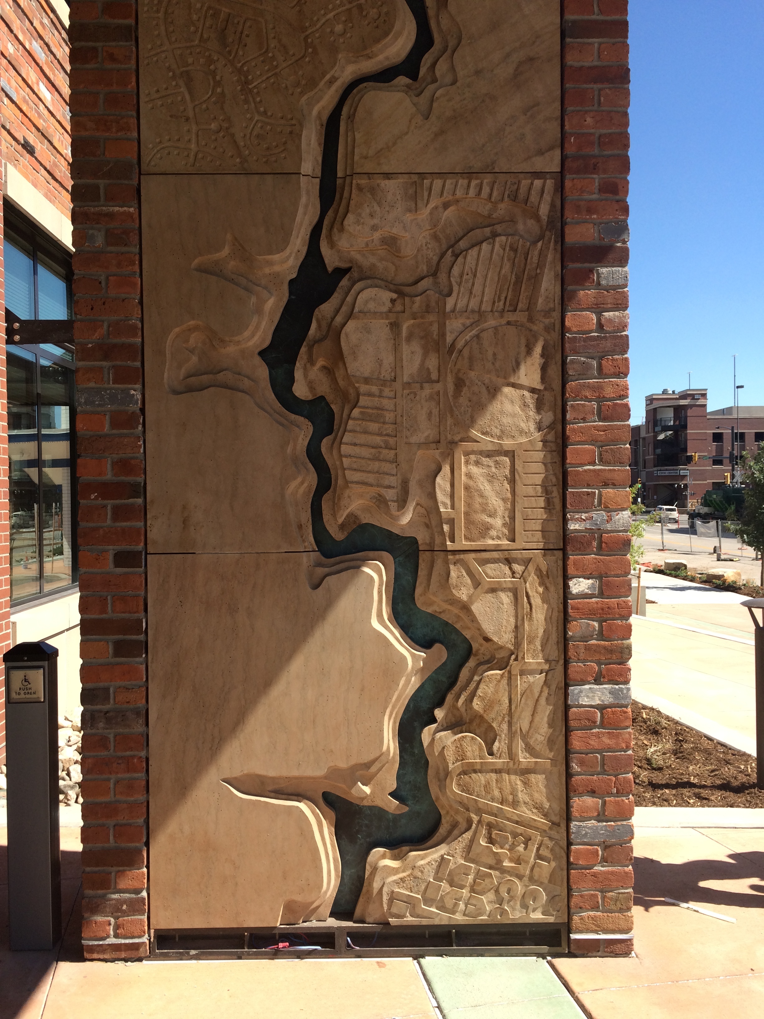  Entry feature wall with Poudre River topography,&nbsp;by Chevo Studios. 