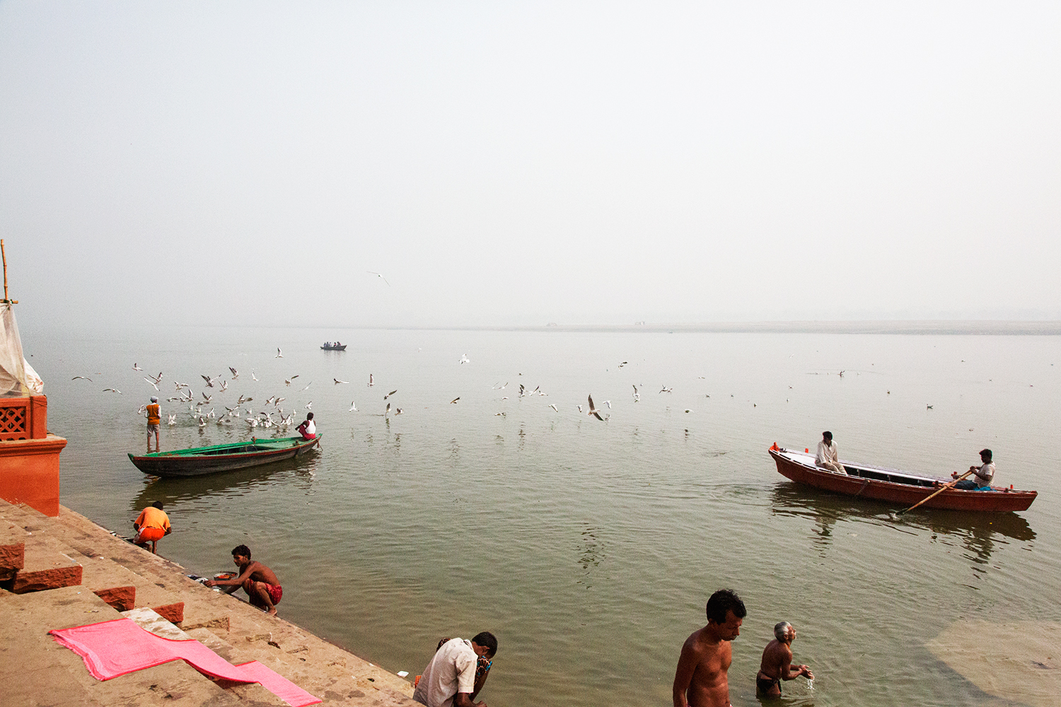  Morning bathers washing in the sacred Ganga River in Varanasi Uttar Pradesh, India. 