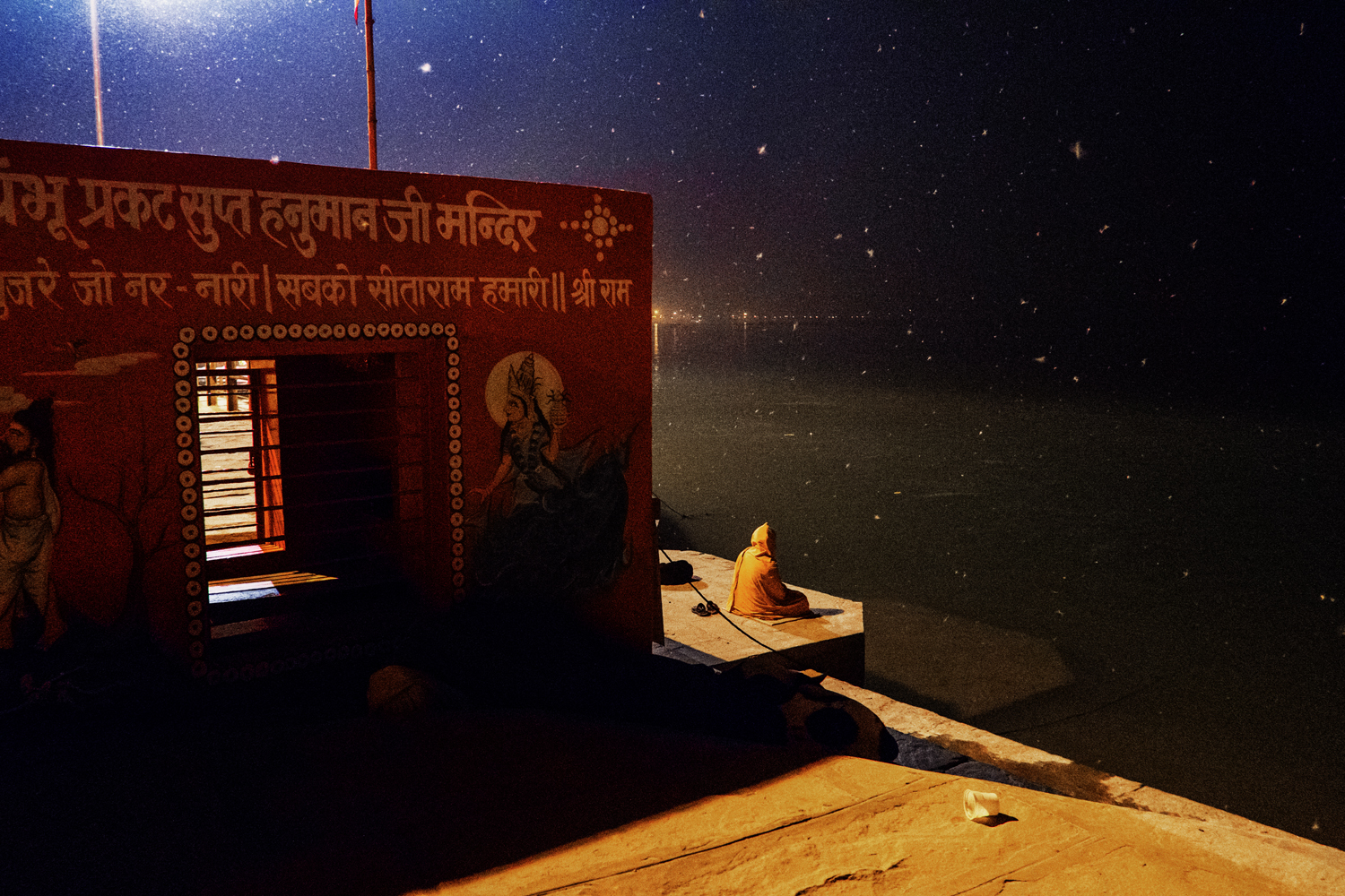  A devotee meditates in front of a small temple near Assi Ghat a cremation site overlooking the Ganga River. Thousands of devotees and pilgrims flock continuously to the holy city of Varanasi in Uttar Pradesh, India. 