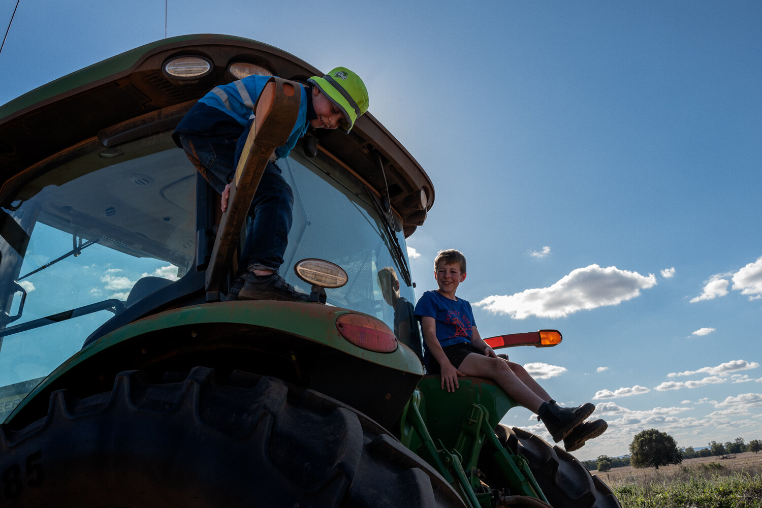  Matt Randall’s sons, Austin and Riley, playing on a tractor at their farm. The Randalls have used baiting and burning to keep the mice out of their fields, but the rodents have slipped into their home. 